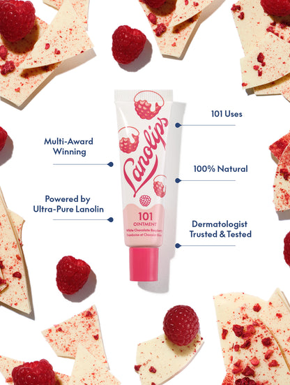 Lanolips 101 Ointment Multi-Balm in White Chocolate Raspberry, 100% natural ultra-pure lanolin lip balm and skin ointment, dermatologist tested with 101 uses, surrounded by fresh raspberries and white chocolate shards.